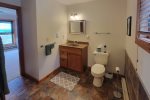 Driveway Entry Level First Floor: Master Suite w/ Queen Bed - En Suite with Tub/Shower Combo